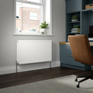 Stelrad K3 radiator positioned against a grey wall in an home office room