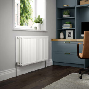 Stelrad K3 radiator positioned against a grey wall in an home office room