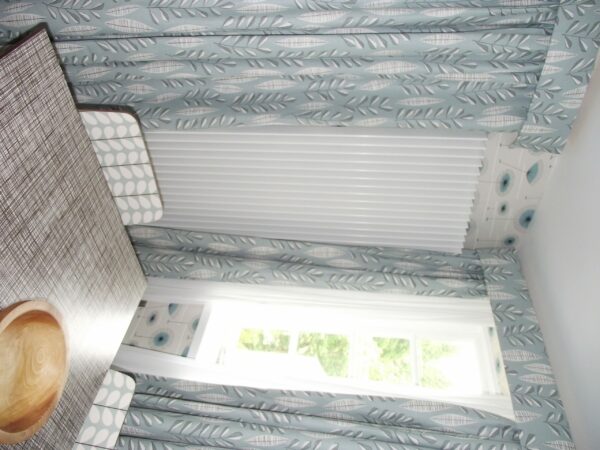 White Concord Slimline radiator in a home dining area