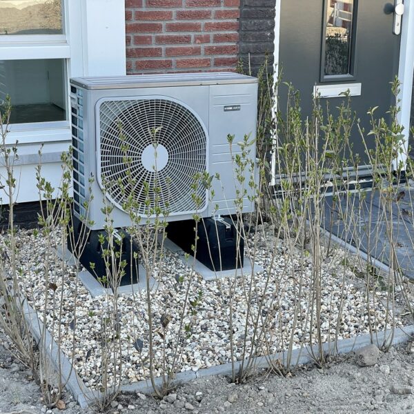 an air source heat pump outside a house