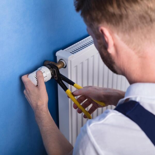 Man fixing radiator