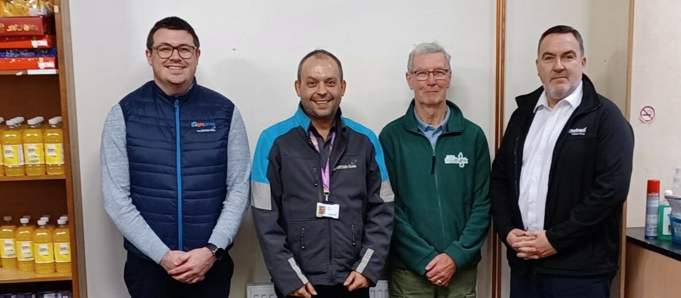 Stelrad's Tom McGrory with members of the team responsible for the heating system installation at the Foodbank